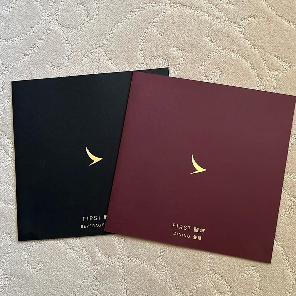 Cathay Pacific first class Amenity Travel, pajama and dining menu and drink list